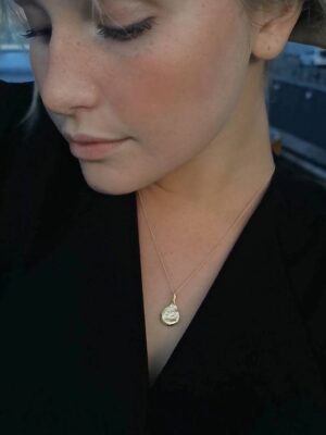 organic shaped necklace with botanical figure pendant model