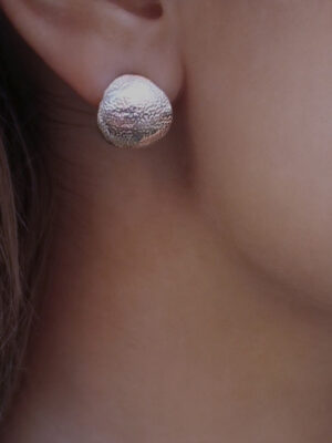 hoops with orange silver pattern surface close up