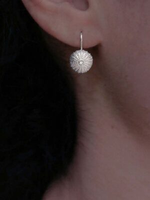 silver sea urchin with white topaz model close up
