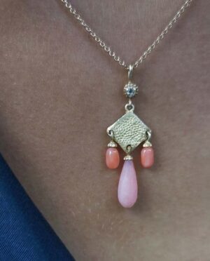 necklace with coral and opal model close up