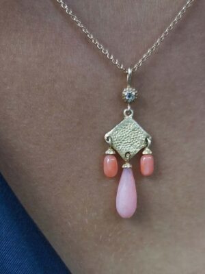 necklace with coral and opal model close up