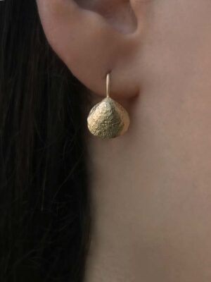 little shell shaped earring close up