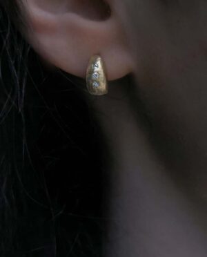 hoops with three white topaz model close up