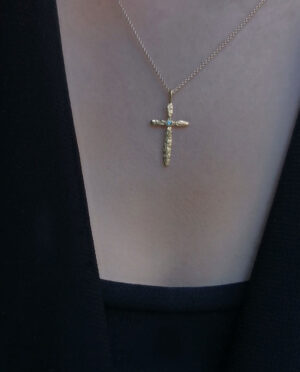 cross with light blue apatite model close up