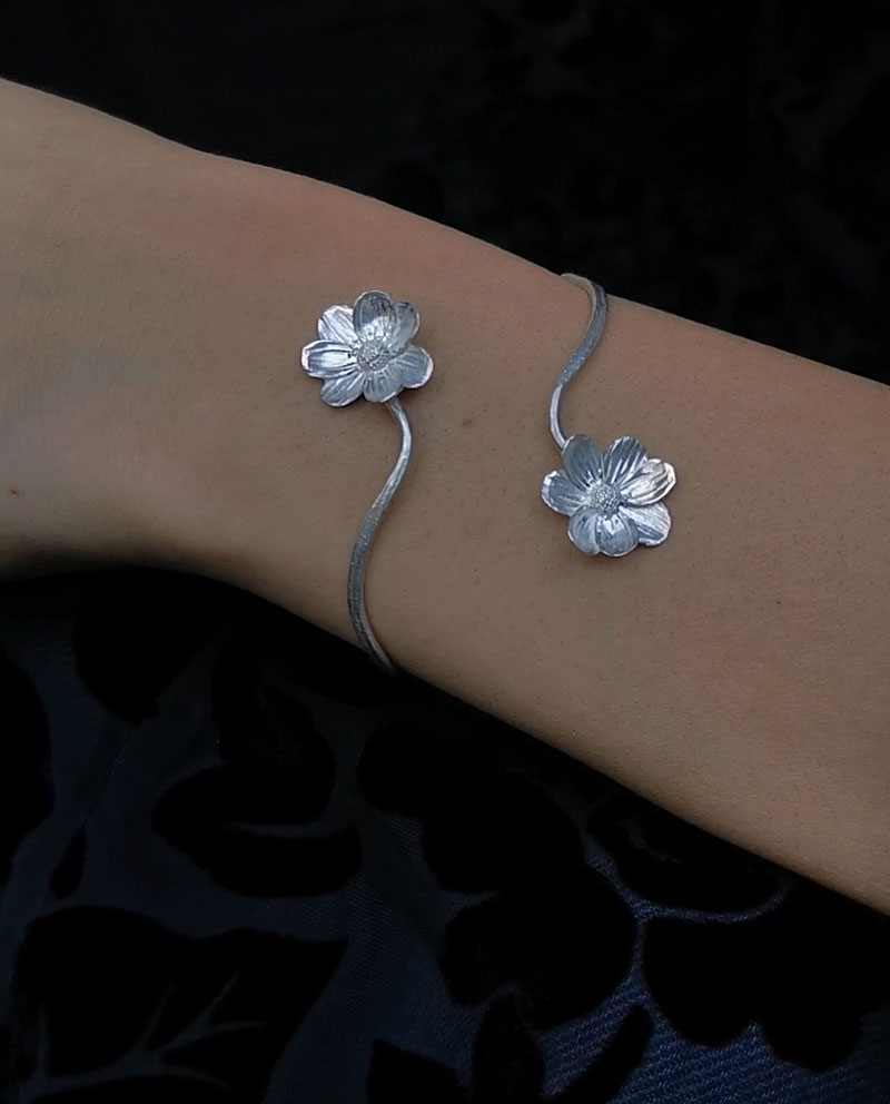 hammered silver bracelet with two flowers