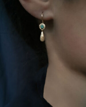 earring with green onyx model close up
