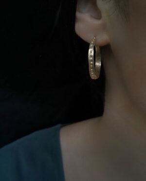antique designed hoops with small dots close up