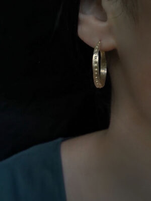 antique designed hoops with small dots close up