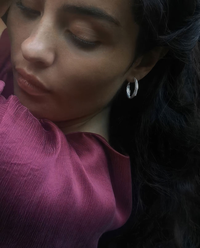 silver hoop with roman pattern