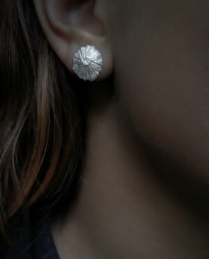 silver shell earring close up