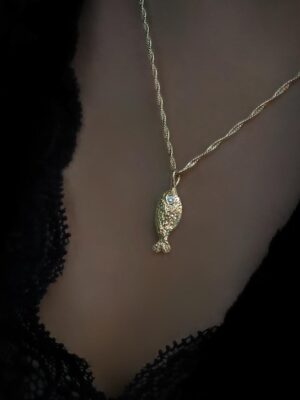 fish with twisted necklace close up