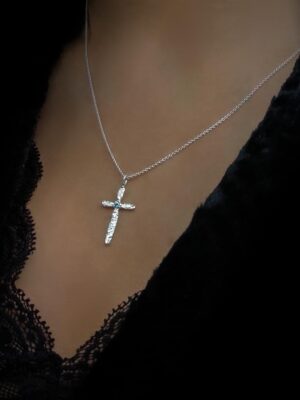 silver cross with light blue apatite close up